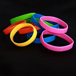 Dazzling Toys 48 Pack Bracelets | 4 Dozen Rubber Neon Monkey Wristbands | Pack of 48 | Makes Great Kids Party Favors, Rewards, Gifts.