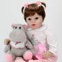Aori Lifelike Realistic Reborn Baby Doll 22 Inch Real Looking Weighted Reborn Doll with Pink Clothes and Accessories Best Birthday Set for Girls Age 3